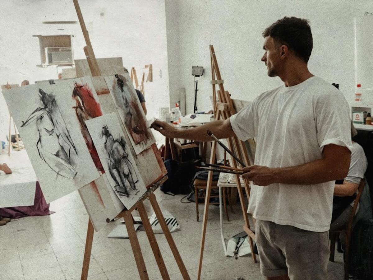 Subiaco artist Ryan Ahern painting in his home studio